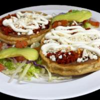 Sopes (2) · Thick tortillas with raised edges topped with refried beans, meat of your choice, fresh whit...