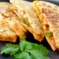 Chicken Quesadilla · Marinated grilled chicken, cheddar Jack cheese, sautéed peppers, onion, sour cream, and salsa.