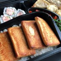 Pan Fried Tofu Bento · Pan Fried Tofu served with seaweed salad, pickled radish, 4pc California Rolls, 2 pc pork&ve...