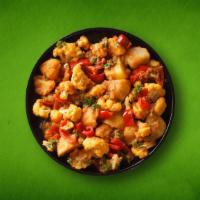 Tres Veggies(Vegan) · Peas and potatoes, simmered to perfection in an onion, tomato and Indian masala curry.