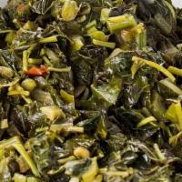 Callaloo · Jamaican spinach sautéed with onions, scotch bonnet peppers, tomatoes and spices.