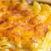 Baked Mac & Cheese · Macaroni elbows baked with Judy’s special cheese sauce.