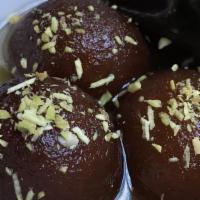 Gulab Jamoon · Small fried balls soaked in a sweet syrup with saffron.