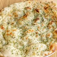 Garlic Naan · Favorite. Minced garlic tops the naan before it gets cooked, garnished with chives.