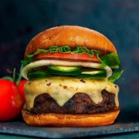 Happy Jalapeño Burger · Beyond Meat patty grilled and topped with melted vegan cheddar cheese, jalapenos, lettuce, t...