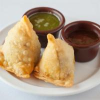 Vegetable Samosa · Deep fried pastry stuffed with vegetable.