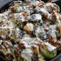 Roasted Brussels Sprouts · Brussels sprouts roasted with olive oil, garlic &. hickory bacon, drizzled with creamy vinai...