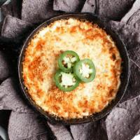 Jalapeño Popper Dip · Baked 3-cheese dip with diced jalapeños, bacon & a crispy breadcrumb topping. Served with bl...