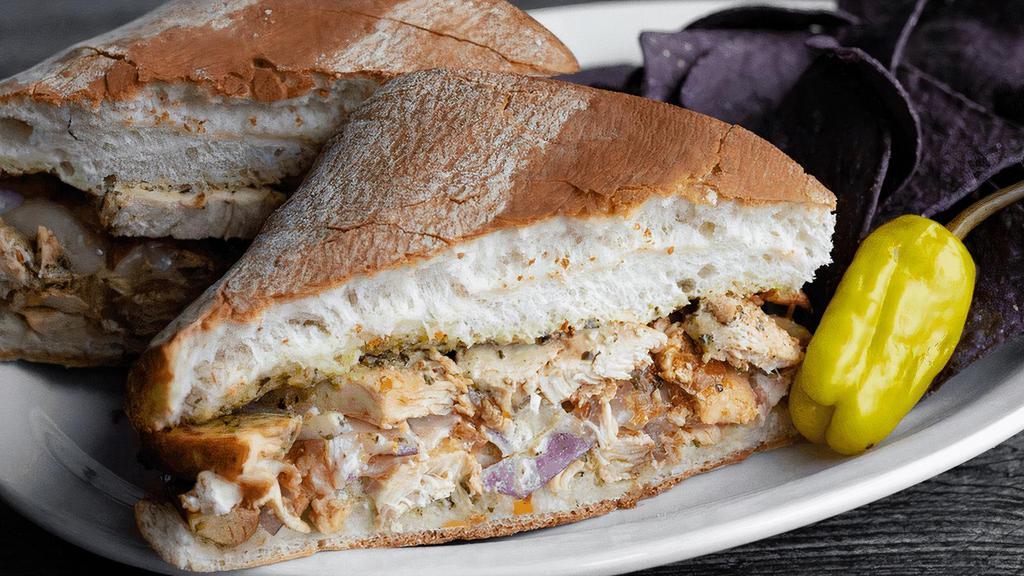 Santa Fe Chicken · Marinated chicken sautéed with red onions & tomatoes. Topped with melted provolone & pesto mayo. Served with blue tortilla chips. (cal 1170)