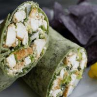 Chicken Caesar Wrap · Chopped romaine, seasoned chicken, asiago cheese, croutons & creamy Caesar dressing in a spi...