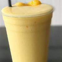 Oasis Smoothie · Mango, peach, pineapple, banana, apple juice, honey, ice.