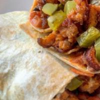 Nashville Chicken Wrap · Nashville style hot chicken, cole slaw, bread and butter pickles, tomato, wrapped in a flour...