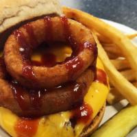 Bbq Burger · Topped with Cheddar cheese, fried onion rings, lettuce, tomato and BBQ sauce.