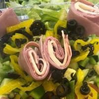 Antipasto · Our garden salad with banana peppers, black olives and ham, genoa and provolone.