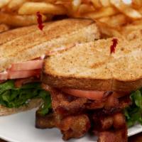 The Blt · The perfect iteration of an American Classic. Wheat toast and mayo with hardwood smoked baco...