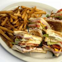 Triple Decker Club Sandwich · Deli sliced ham and smoked turkey with applewood bacon strips, aged cheddar and Swiss cheese...