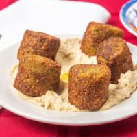 Falafel Humus · Deep-fried ball made with ground chickpea, served with hummus & pitas bread.