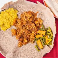 Chicken Infillay · Tender chicken strips sauteed with spiced tomatoes served with a sides of lentil, cabbage & ...