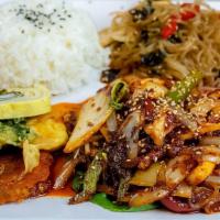 Spicy Squid With Rice (오징어 볶음) · Stir-fried squid and vegetables with spicy sauce.