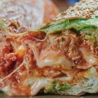 Meatball Parm · cheese blend, garlic basil oil, served on a seeded roll