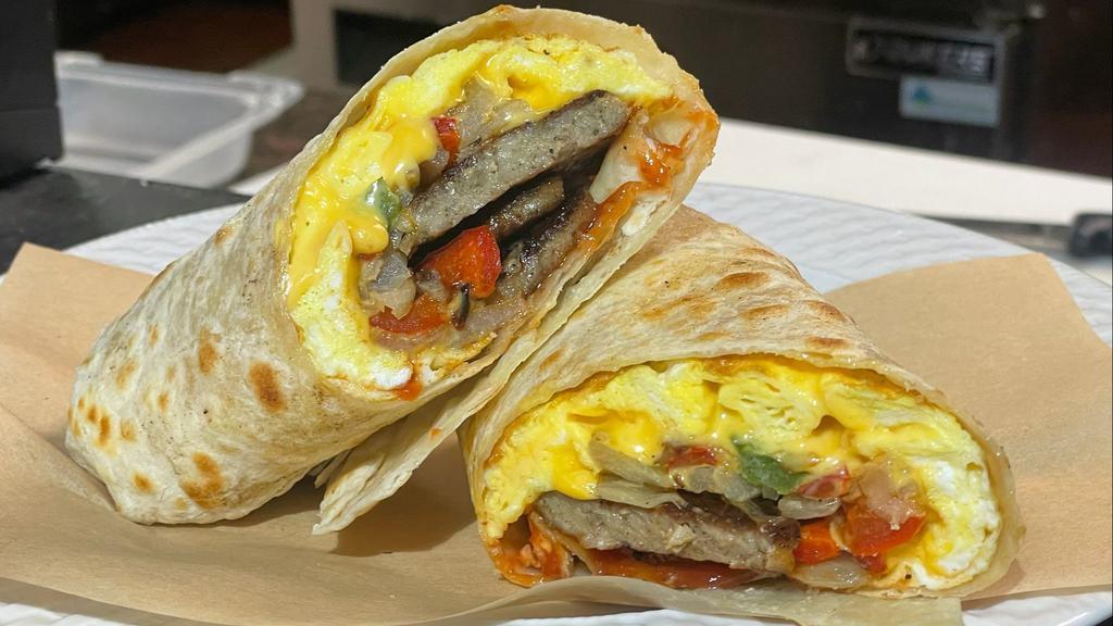 Jersey Giant Breakfast Burrito · Three scrambled eggs, Cheddar cheese, red and green onions, choice of Taylor ham, sausage, bacon, turkey bacon, or grilled vegetables.
