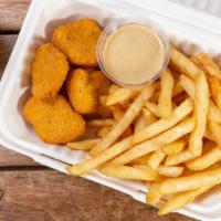 Chicken Nuggets Combo · Served with fries, dipping sauce and can soda.
