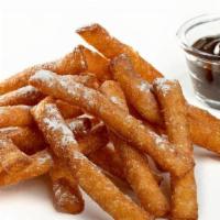 Funnel Cake Fries · funnel cake stix topped with powdered sugar + hot fudge to dip