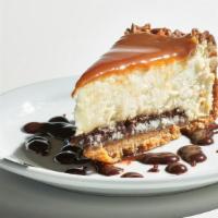 Turtle Cheesecake · New York style cheesesteak, fudge, caramel, toasted pecans + graham cracker crust