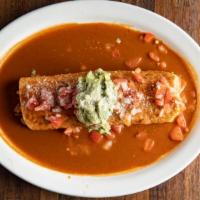 Expreso Burrito · Pork Chile verde rice beans and cheese wrapped in a flour tortilla covered with red sauce ga...