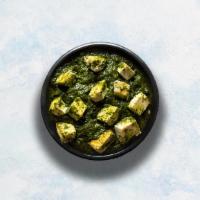 Palak Paneer · Slowly cooked farm-fresh spinach studded with perfectly fried cottage cheese cubes. Served w...