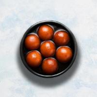 Gulab Jamun  · 3 pieces of soft berry-sized balls soaked in rose flavored sugar syrup.