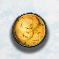Ras Malai  · 3 pieces of cottage cheese patties soaked in creamy flavored milk.