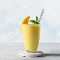 Mango Lassi · Sweetened Indian drink made with freshly churned yogurt flavored with mango pulp.