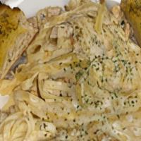 Fettucine Alfredo · Served with a side salad and garlic bread. Add chicken, or shrimp for an additional charge.
