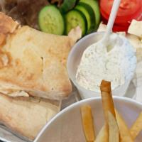 Gyro Plate · Lettuce, tomato, onion, tzatziki, Feta, and your choice of chicken or beef and lamb. All din...