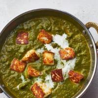 Palak Paneer · Fresh homemade cottage cheese gently cooked with garden spinach and mild spices.