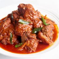 Chicken Curry · Marinated meat cooked in tomato-onion based gravy with Indian spices, herbs.