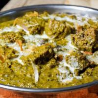 Lamb Saag · Delicately spiced cooked in spinach lightly creamy herbs and spices.