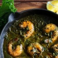 Shrimp Saag · Delicately  spiced cooked in spinach lightly creamy herbs and spices.
