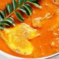 Fish Curry · Tomato and onion-based curry with curry leaves, mustard seeds, and freshly blended fish spic...