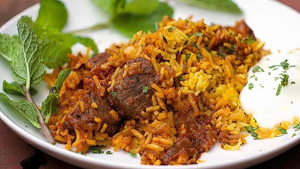 Lamb Biryani · A delightful combination of chicken, lamb, shrimps or veggie cooked with basmati rice, herbs, fresh mint, flavored in saffron and delicate spices.