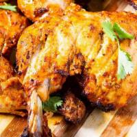Tandoori Chicken · King of kababs whole chicken marinated overnight with yogurt, ginger, garlic, and spices)