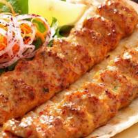 Chicken Seekh Kabob · Ground chicken mixed with chopped onions, cilantro, herbs & spices on a skewers