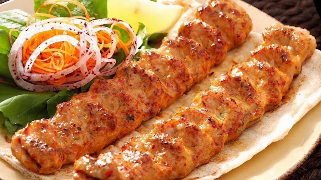 Chicken Seekh Kabob · Ground chicken mixed with chopped onions, cilantro, herbs & spices on a skewers