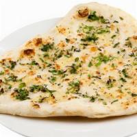 Garlic Naan · Topped with freshly chopped garlic and baked in a tandoori clay oven)