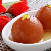 Gulab Jamun · Dry milk balls served in rose flavored sugar syrup and a touch of cardamom