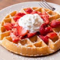 Waffle & Strawberries · Belgian waffle with fresh strawberry topping and whipped cream.