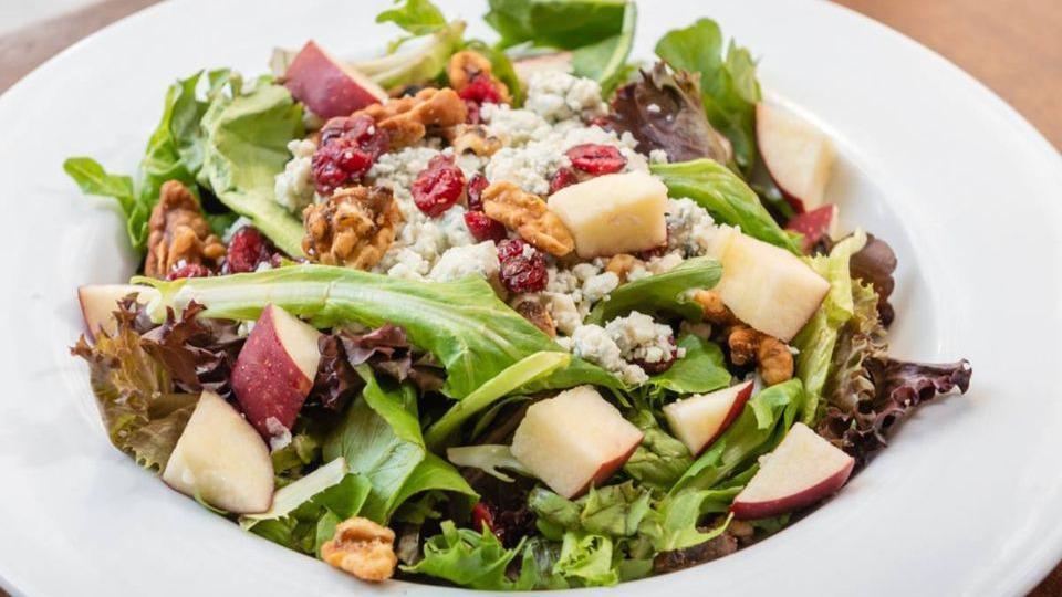 Cafe Salad · Mixed greens, candied walnuts, dried cranberries, bleu cheese crumbles, apple slices and grilled chicken. Served with Fuji apple vinaigrette.