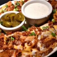Lunch Irish Nachos · Fried potatoes, jack and cheddar, bacon, green onion, pickled jalapenos, and ranch.