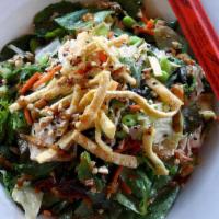 Dinner Asian Chicken Salad · Spring mix, sriracha noodles, edamame, green onions, crispy wontons, carrots, sesame vinaigr...